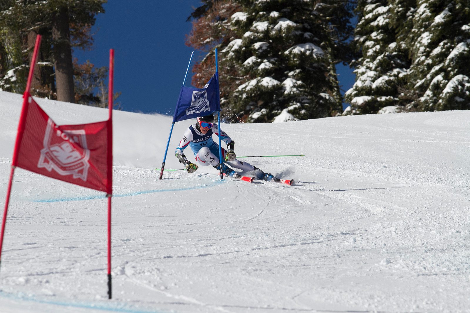 Sugar Bowl Academy ski racer turning around a GS gate.
